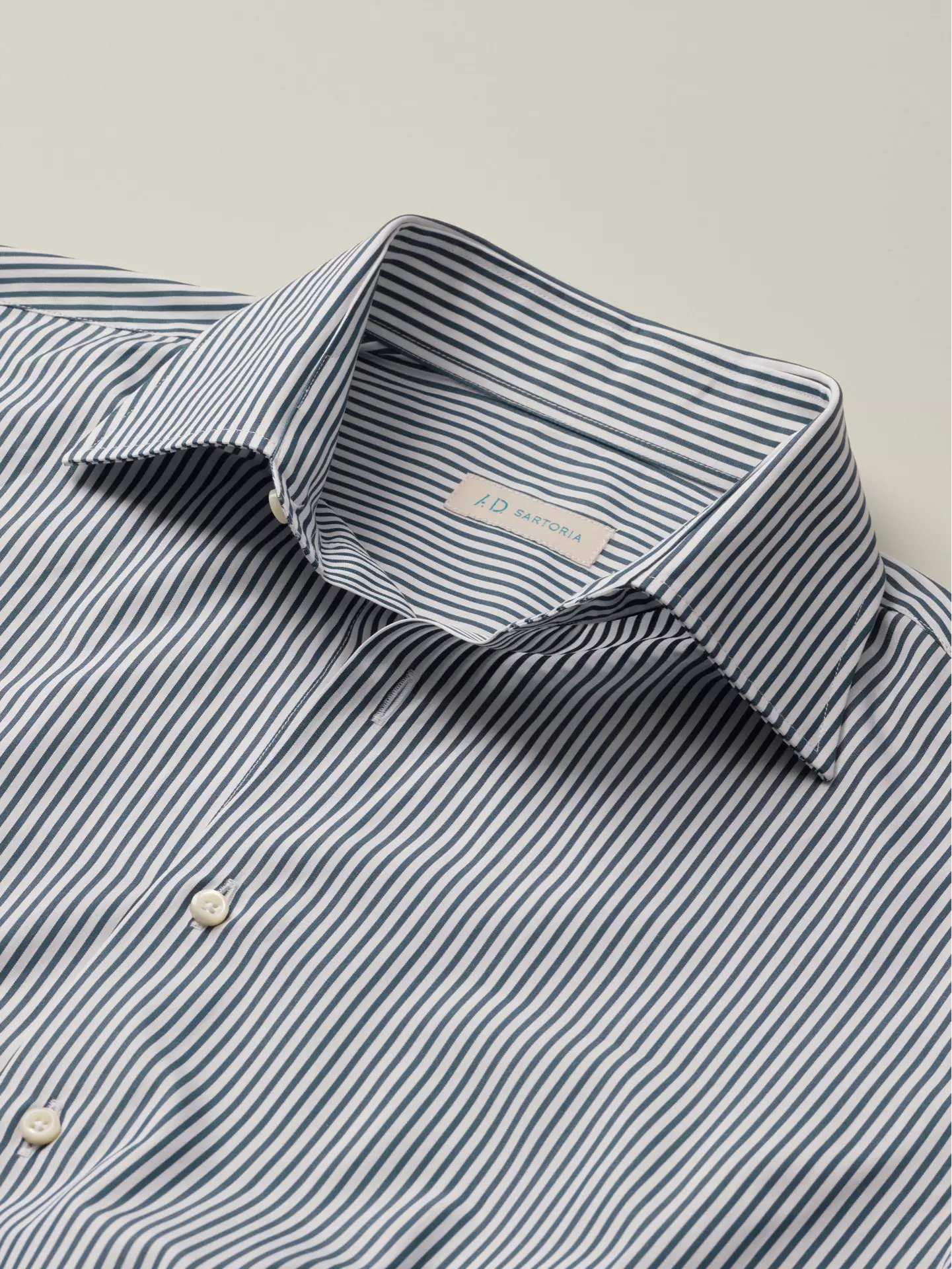 Close-up of a striped shirt with point collar