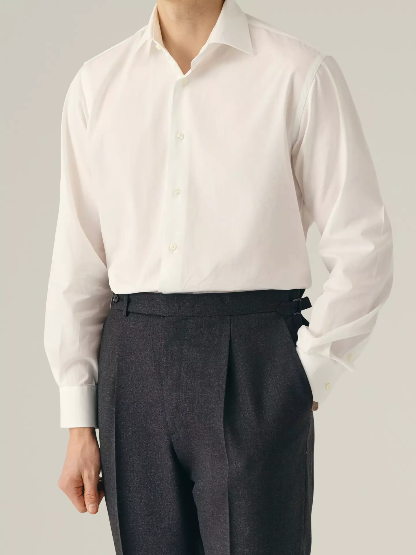 Person wearing a white dress shirt