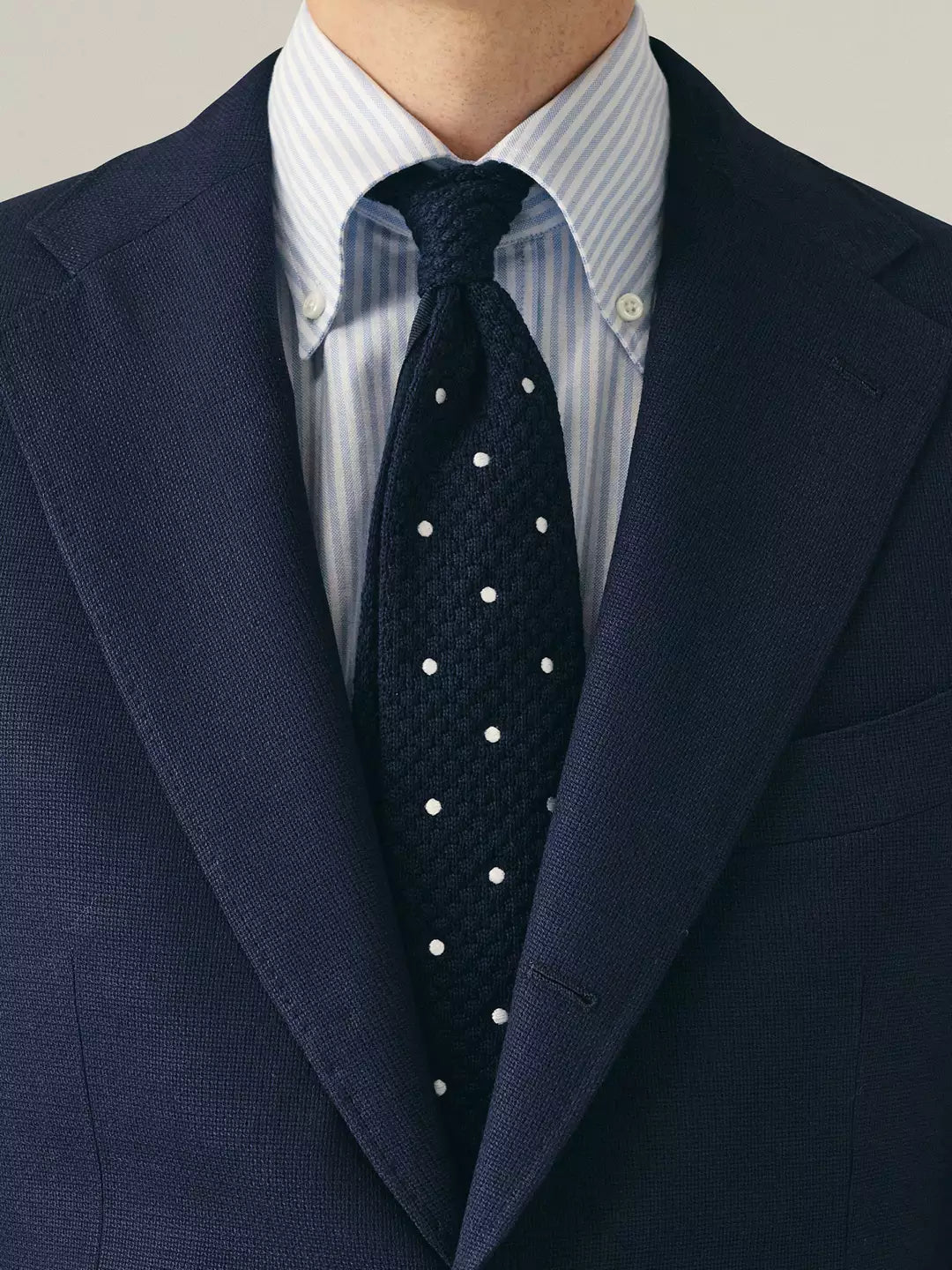 Mens jacket in blue hopsack wool fabric with striped shirt and knitted tie