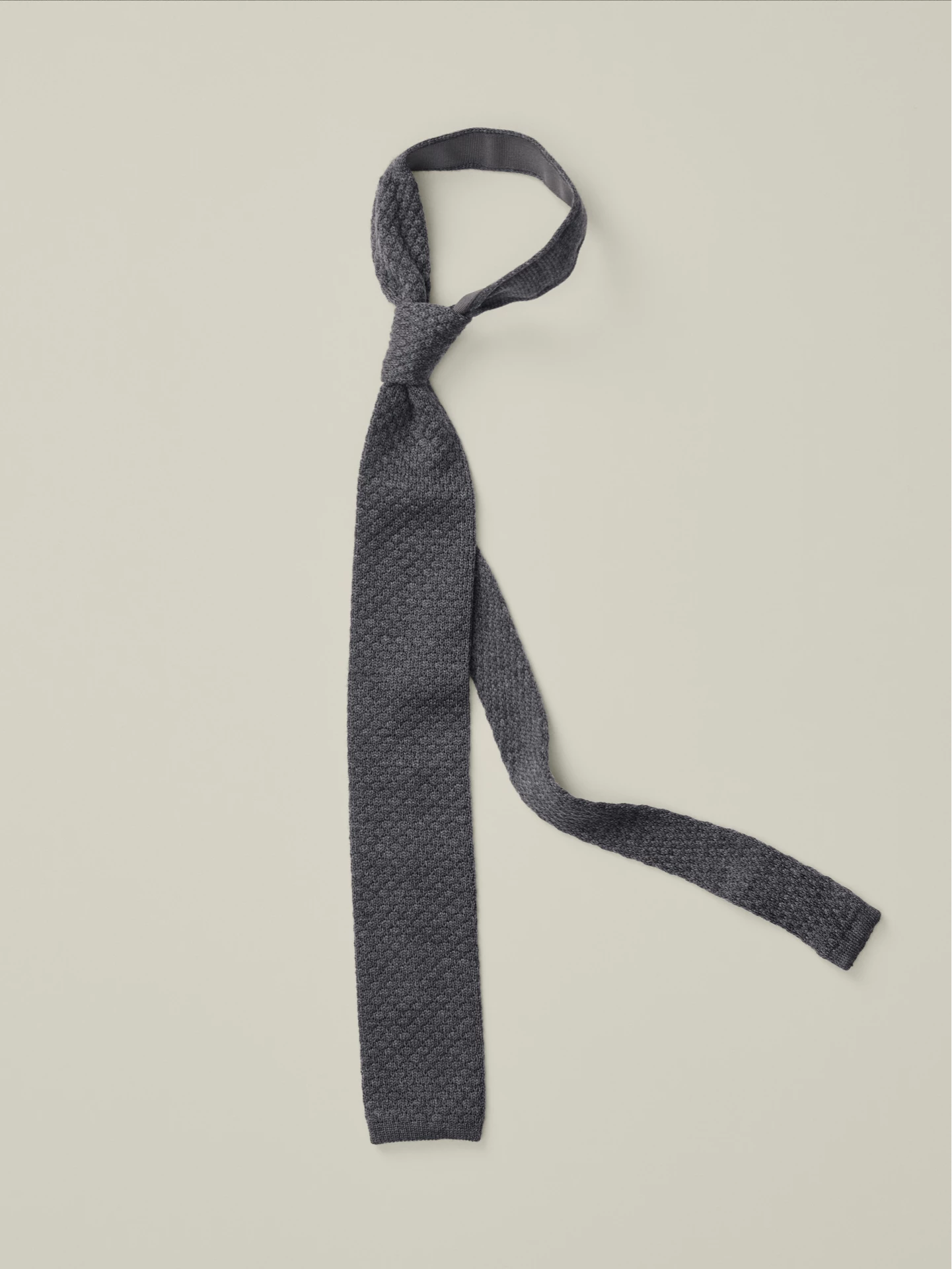Grey knitted tie