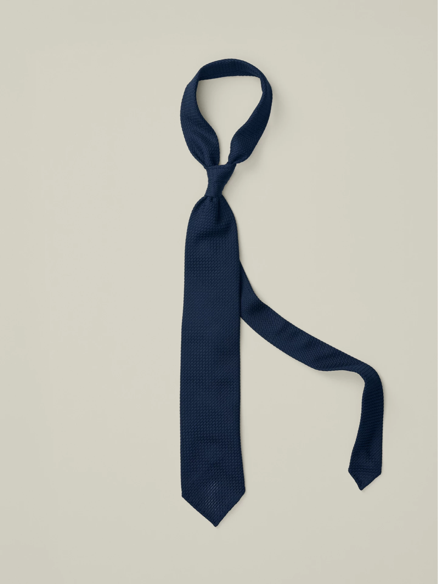 Navy blue Grenadine tie.